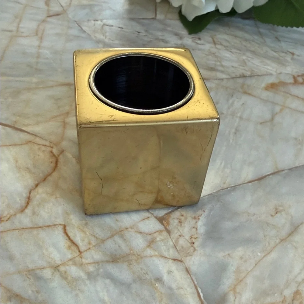 Elegant Gold Candle Holder with White Floral Arrangement